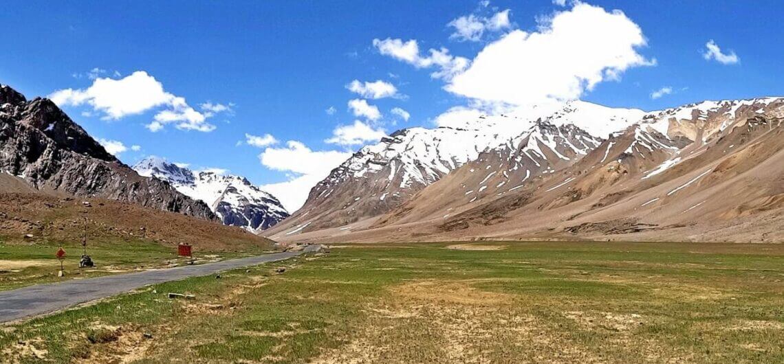Best Places to Visit in Spiti Valley: A breathtaking view of the Spiti River winding through the rugged Himalayan terrain, with snow-capped peaks in the distance. Nature's masterpiece in the heart of Himachal Pradesh, India.
